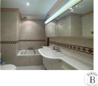 a bathroom with a sink and a bath tub and a sink at La Palme studio in Cannes