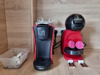 a red and black blender sitting on top of a counter at Appartement entier cosy au calme in Le Cannet