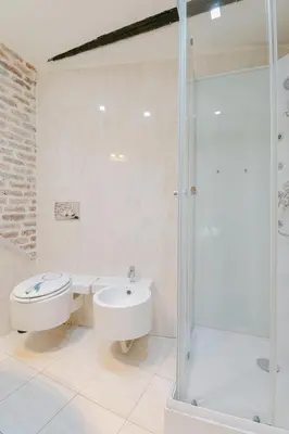 a bathroom with a shower and a toilet and a sink at La Casa du Suquet, zone piétonne in Cannes