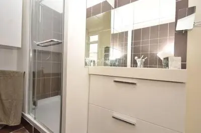 a bathroom with a glass shower and a sink at La Terrasse 4 Cannes French Riviera in Cannes