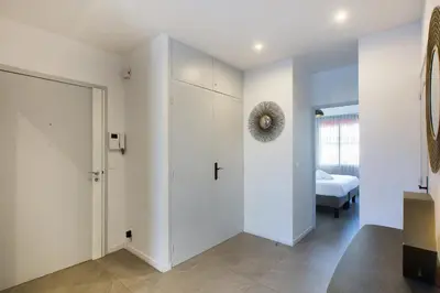 a room with a door and a bedroom with a bed at YELLOW DUBOY D'ANGERS 2 Bedrooms in Cannes