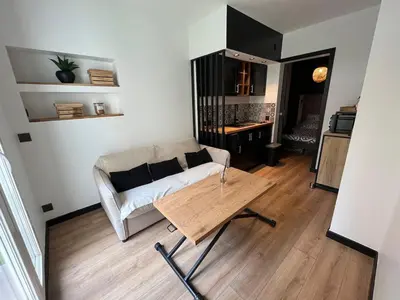 a living room with a couch and a coffee table at T2 avec terrasse 4p, Cannes centre in Cannes