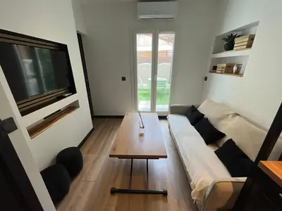 a living room with a couch and a coffee table at T2 avec terrasse 4p, Cannes centre in Cannes