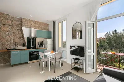 a living room with a couch and a table at Azurenting - Bastide Mira - 1 chambre - Balcon in Cannes