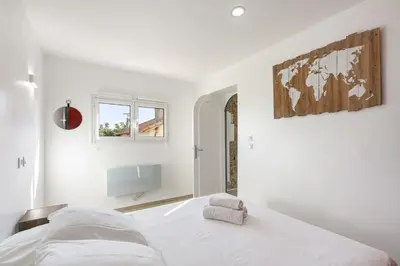 a large house with green shutters and a patio at Azurenting - Bastide Mira - 1 chambre - Balcon in Cannes
