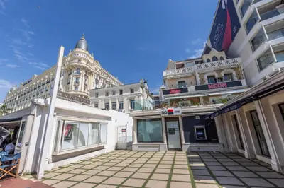 a group of buildings on a city street at LB Vacation Rentals I Beautiful 2BR Apt, Renovated in 2025, La Croisette, Minutes from Beach and Palais in Cannes