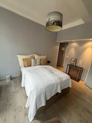 a bedroom with a large white bed in a room at Foch 1 - Luminous apartment in city center w balcony in Cannes