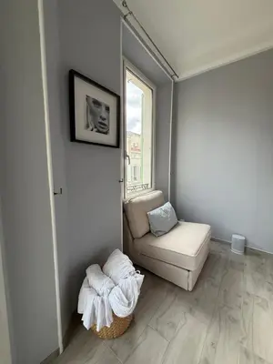 a living room with a couch and a chair at Foch 1 - Luminous apartment in city center w balcony in Cannes