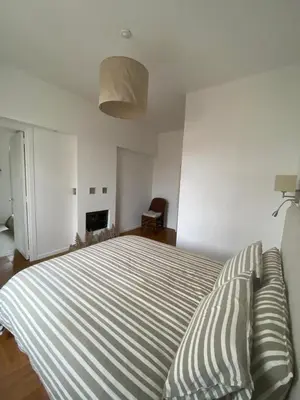 a bedroom with a bed with two pillows on it at Lisa Appartement de charme in Cannes