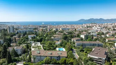 an aerial view of a city with the ocean at La Gloriette Azur piscine sauna vue mer in Cannes
