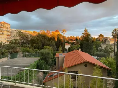 a view of a city from a balcony at Appartement moderne avec vue mer à Cannes in Cannes