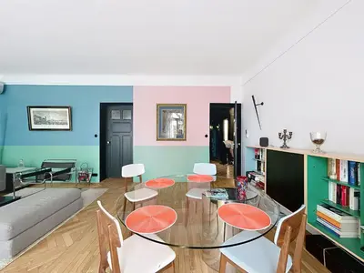 a living room with a glass table and chairs at Vega in Cannes