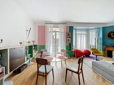 a living room with a couch and a table and chairs at Vega in Cannes