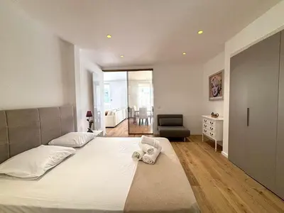 a bedroom with a bed with a towel on it at Palais Miramar Croisette 2 BRD Gold Suite in Cannes