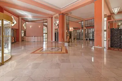 a large room with a lobby with a large tile floor at Palais Miramar Croisette 2 BRD Gold Suite in Cannes