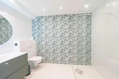a bathroom with a toilet and a green wallpaper at Sumptuous villa - AC- 6BR- 12P- Cannes in Cannes