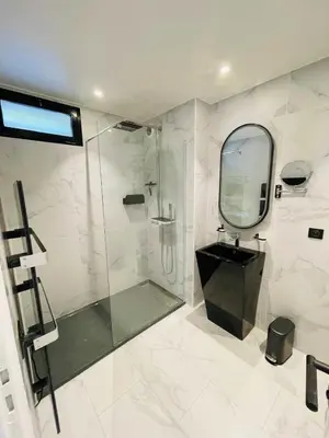 a bathroom with a shower and a sink and a mirror at Sumptuous villa - AC- 6BR- 12P- Cannes in Cannes