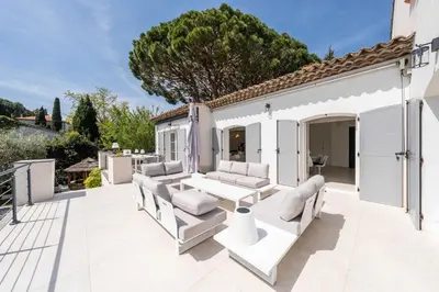 a patio with couches and a table at Sumptuous villa - AC- 6BR- 12P- Cannes in Cannes