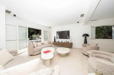 a living room with white furniture and windows at Sumptuous villa - AC- 6BR- 12P- Cannes in Cannes