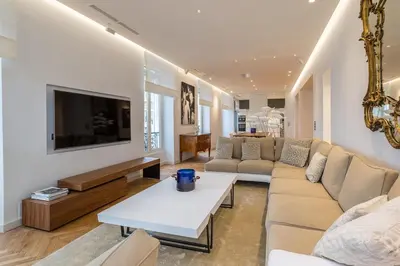 a living room with a couch and a table at Cannes Croisette 4 bedrooms - 2C in Cannes