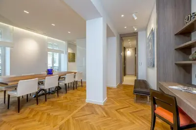 a dining room with a long table and chairs at Cannes Croisette 4 bedrooms - 2C in Cannes