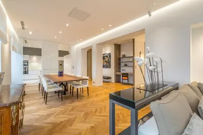 a living room with a table and a dining room at Cannes Croisette 4 bedrooms - 2C in Cannes