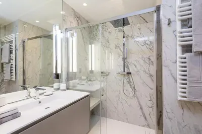 a bathroom with a sink and a shower at Cannes Croisette 4 bedrooms - 2C in Cannes
