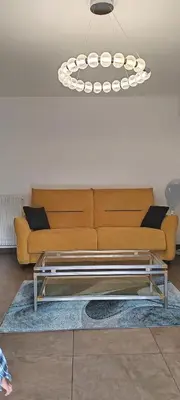 a living room with a couch and a coffee table at T2 chic non loin de palais festival in Cannes