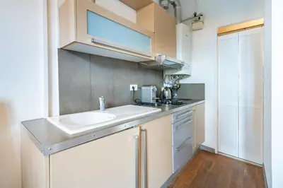 a kitchen with a sink and a counter top at Au coeur du Suquet - 2 pièces cosy - Climatisation séjour in Cannes