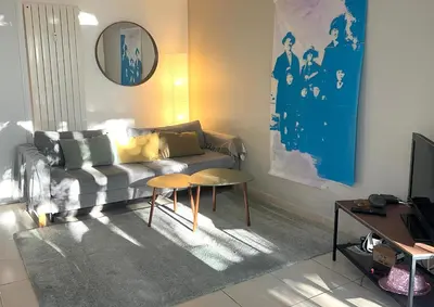 a living room with a couch and a table at Superbe 2 pièces à Cannes in Cannes