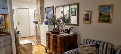 a living room with a couch and a refrigerator at Terrasse Bergerie in Cannes