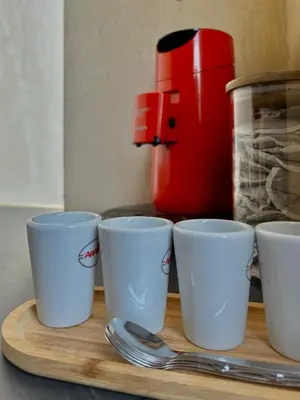 a group of cups and spoons on a cutting board at T2 cosy, calme à 5 min de la Croisette in Le Cannet