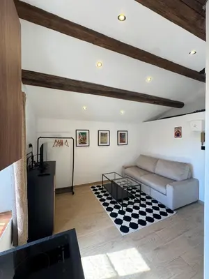 a living room with a couch and a table at Studio Cannes, near Croisette in Cannes
