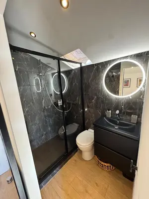 a bathroom with a toilet and a sink and a mirror at Studio Cannes, near Croisette in Cannes