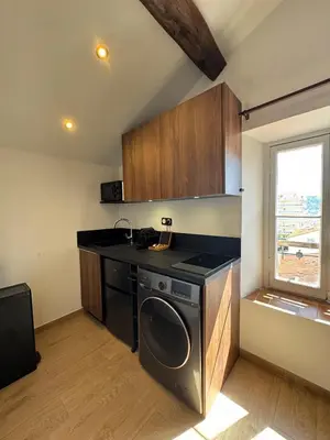 a kitchen with a washer and dryer in a room at Studio Cannes, near Croisette in Cannes