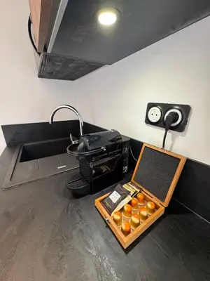 a counter with a box of oranges and a printer at Studio Cannes, near Croisette in Cannes