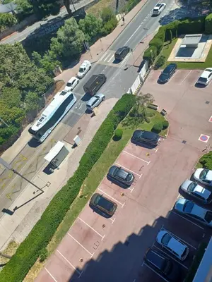 an aerial view of a parking lot with parked cars at Cannes Studio Vue mer Panoramique Château de la Mer in Cannes