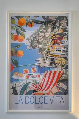 a framed picture of a beach chair and cruise ships at Le Cali - Front de mer - Palm Beach - VCA in Cannes