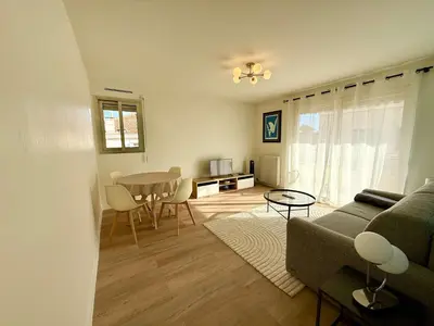 a living room with a couch and a table at C018 - Lumineux Appartement - Proche plage in Cannes