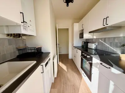 a kitchen with white cabinets and a sink at C018 - Lumineux Appartement - Proche plage in Cannes