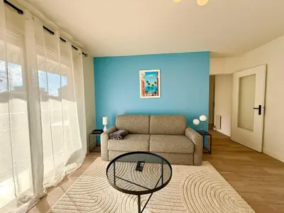 a living room with a couch and a table at C018 - Lumineux Appartement - Proche plage in Cannes