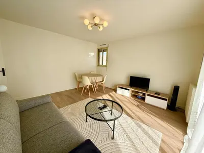 a living room with a couch and a table at C018 - Lumineux Appartement - Proche plage in Cannes