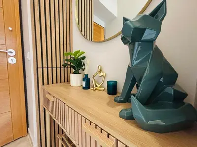 a statue of a cat sitting on top of a dresser at Le Sainte Rose Standing, Cannes center on foot in Cannes