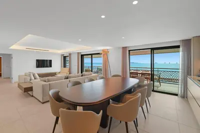a living room with a table and chairs at REF 1998 - Cannes - Sea view apartment for rent in Cannes