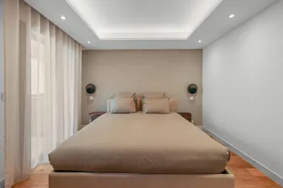 a bedroom with a large bed in a room at REF 1998 - Cannes - Sea view apartment for rent in Cannes