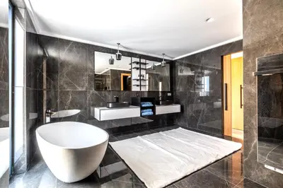 a bathroom with a white tub and a sink at Villa Dream Cannes in Cannes