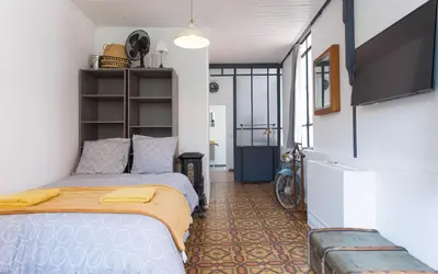 a bedroom with a bed in a room at Aura Apartments by Halldis in Cannes