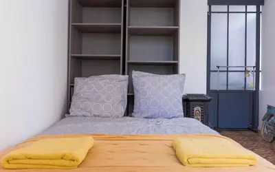 a bedroom with a bed with two pillows at Aura Apartments by Halldis in Cannes