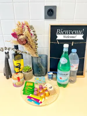 a counter top with some food and a bottle of water at Cannes Breeze in Cannes