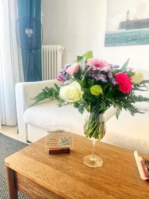 a vase of flowers sitting on a coffee table at Cannes Breeze in Cannes
